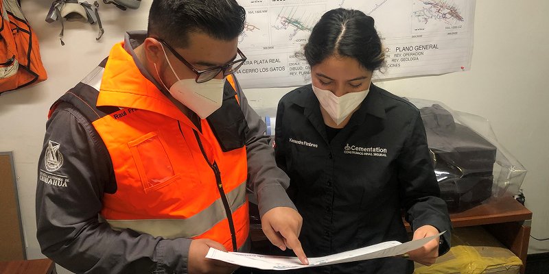 Man and woman looking at document